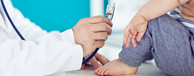 Doctor using a stethoscope on a patient